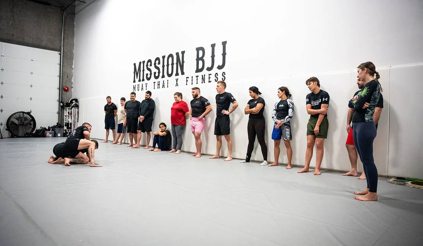 Members training across the open mats at Mission BJJ
